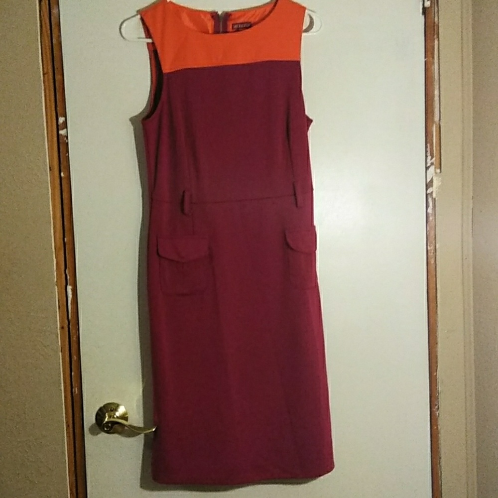 We are selling a berganey and orange dress